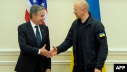 U.S. Secretary of State Antony Blinken (left) shakes hands with Ukraine’s Prime Minister Denys Shmyhal at the Cabinet of Ministers in Kyiv on September 11.