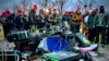 U.S. - Supporters of US President Donald Trump stand next to media equipment they destroyed during a protest on JAnuary 6, 2020 outside the Capitol in Washington, DC.