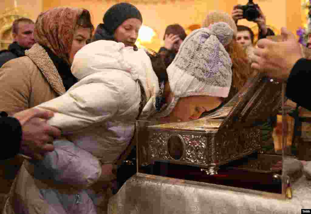 A Russian Orthodox believer kisses the shrine with the Gifts of the Magi relic displayed at the Resurrection Novodevichy Convent in St. Petersburg on January 14. (ITAR-TASS/Ruslan Shamukov)