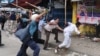 Bangladeshi police baton-charge Islamists during clashes in Dhaka on May 5. Opposition groups claim hundreds of Hefazat supporters have disappeared since.