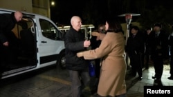 Belarusian opposition leader opposition leader Svyatlana Tsikhanouskaya welcomes Nobel laureate Ales Byalyatski after his release from a Belarus prison.