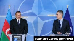 BELGIUM -- Azerbaijani President Ilham Aliyev (L) and NATO Secretary-General Jens Stoltenberg give a press conference at the end of a meeting at NATO headquarters in Brussels, November 23, 2017