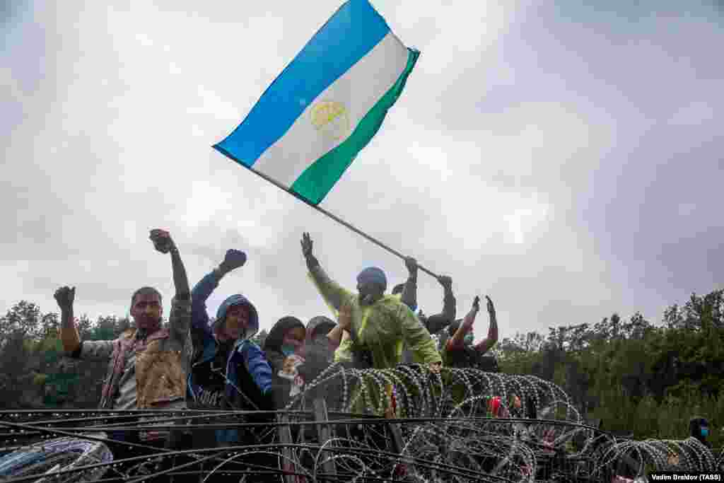 People wave flags as a part of a protest on August 16.