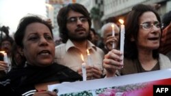 Activists and supporters of slain Punjab Governor Salman Taseer march in tribute during a rally in Karachi on January 5.