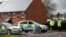 Police officers guard the cordoned-off area around the home of former Russian intelligence officer Sergei Skripal in Salisbury, Britain, on April 3.