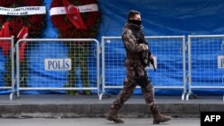 A Turkish special-force police officer patrols in front of the Reina nightclub in Istanbul, three days after a gunman killed 39 people early on January 1.