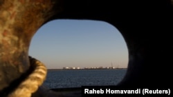 IRAN -- A general view of an oil dock is seen from a ship at the port of Kalantari in the city of Chabahar, 300km (186 miles) east of the Strait of Hormuz, January 17, 2012