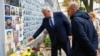 French Minister for Europe and Foreign Affairs Jean-Noel Barrot (right) and Ukrainian Foreign Minister Andriy Sybiha visit the Memory Wall of Fallen Defenders of Ukraine outside St. Michael's Cathedral in Kyiv on October 19.