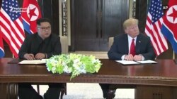 Trump, Kim Sign Document After Talks