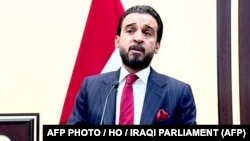 Newly elected parliament speaker Muhammad al-Halbusi addresses the Iraqi parliament in Baghdad on September 15.