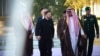 In this handout photograph taken and released by the Ukrainian Presidential Press Service on March 10, 2025, Ukraine's President Volodymyr Zelensky (C-L) is welcomed by Saudi deputy Mecca Governor Prince Badr bin Sultan bin Abdulaziz (C-R) upon his arriva