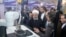 Iranian President Hassan Rohani (center) attends a ceremony to mark National Nuclear Technology Day in Tehran on April 9.