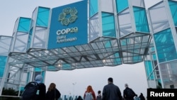 Azerbaijan - People walk near the venue of the United Nations Climate Change Conference (COP29) in Baku, November 14, 2024.