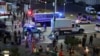 Law enforcement officers and emergency services personnel near the site of an explosion at a restaurant in central Moscow, Russia, on August 1.