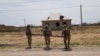 Kazakh sappers remove fragments of ammunition in the town of Arys following a series of deadly explosions there in June 2019. 