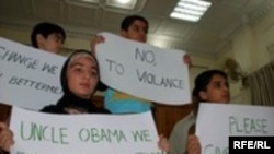 Children in Peshawar declare their support for Obama.