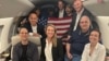 In this image released by the U.S. government, Wall Street Journal reporter Evan Gershkovich (left), former U.S. Marine Paul Whelan (second from right), and RFE/RL journalist Alsu Kurmasheva (right) are seen on a plane after their release from Russia on August 1.