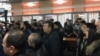 Onlookers gather in the courtroom to watch the announcement of the verdict in the murder case in Qaraghandy on November 4.