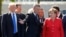 Belgium - (L-R) U.S. President Donald Trump, NATO Secretary General Jens Stoltenberg and German Chancellor Angela Merkel gather with NATO member leaders to pose for a family picture before the start of their summit in Brussels, Belgium, May 25, 2017