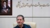 IRAN -- Iran9an Senior Vice-President Eshaq Jahangiri sits in front of a painting of the late revolutionary founder Ayatollah Khomeini during a top-level meeting on prevention and combating the coronavirus, in Tehran, 28 February, 2020