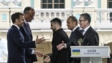 A file photo shows European leaders and Ukrainian President Volodymyr Zelenskyy shaking hands after a joint press conference in Kyiv on May 10, 2025.