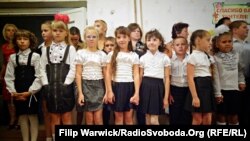 Students arrive for the first day of school in Pervomayske, near the Donetsk airport, on September 1, 2015.