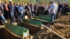 The burial of flood victims in Jablanica, Bosnia-Herzegovina