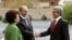 Armenia - Armenian President-elect Serzh Sarkisian (L) shakes hands with former Armenian President Robert Kocharyan (C) and his wife Bella (L) during an inauguration ceremony in Yerevan, 09Apr2008