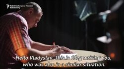 Oleh Sentsov reads a letter of support and hope to detained Ukrainian Service Crimea.Realii journalist Vladislav Yesypenko