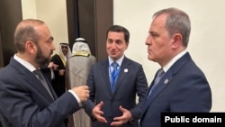 Egypt - Azerbaijani Foreign Minister Jeyhun Bayramov (right) talks to his Armenian counterpart Ararat Mirzoyan during a summit in Sharm el-Sheikh, October 13, 2025.