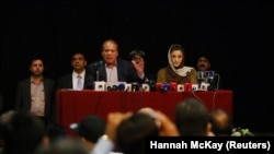 FILE: Former Pakistani Prime Minister Nawaz Sharif, appears with his daughter Maryam Nawaz, at a news conference in London, July 2018.