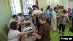 Armenia - People vote in parliamentary elections at a polling station in Yerevan, June 7, 2026.