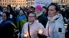 People light candles to mark the third anniversary of Russia's invasion of Ukraine in Helsinki, Finland, on February 24.