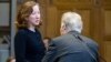 Jennifer G Newstead (L), lawyer for the United States and representative of Iran Mohsen Mohebi talk during the opening of case between Iran and the United States at the The International Court of Justice (ICJ) in the Hague, August 27, 2018. Iran opened 