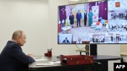 Russian President Vladimir Putin talks to students and teachers via a video link on September 1. 