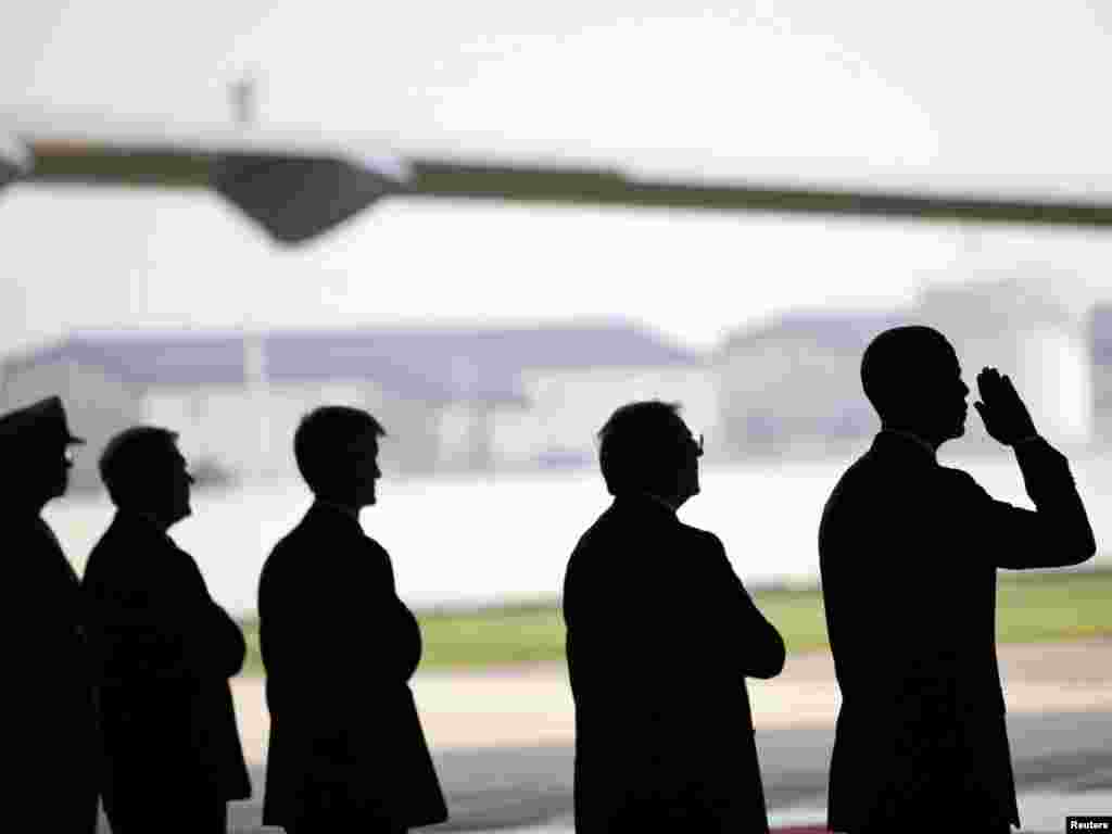 U.S. President Barack Obama salutes during a ceremony for the "dignified transfer" of U.S. and Afghan personnel who died in a helicopter crash in Afghanistan, at Dover Air Force Base in Dover, Delaware, on August 9. Obama honored the 30 U.S. soldiers killed in the crash in a private ceremony from which the media were barred. Photo by Pete Souza/The White House for Reuters