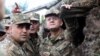 Armenia - Defense Minister Seyran Ohanian (R) inspects Armenian army positions on the border with Azerbaijan, 9Aug2013.