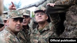 Armenia - Defense Minister Seyran Ohanian (R) inspects Armenian army positions on the border with Azerbaijan, 9Aug2013.