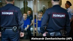 Ukrainian sailors who were captured and taken into Russian custody attend a court hearing in Moscow on May 27.