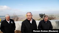 Israeli Prime Minister Benjamin Netanyahu, U.S. Republican Senator Lindsey Graham and U.S. Ambassador to Israel David Friedman visit the border line between Israel and Syria at the Israeli-occupied Golan Heights, March 11, 2019