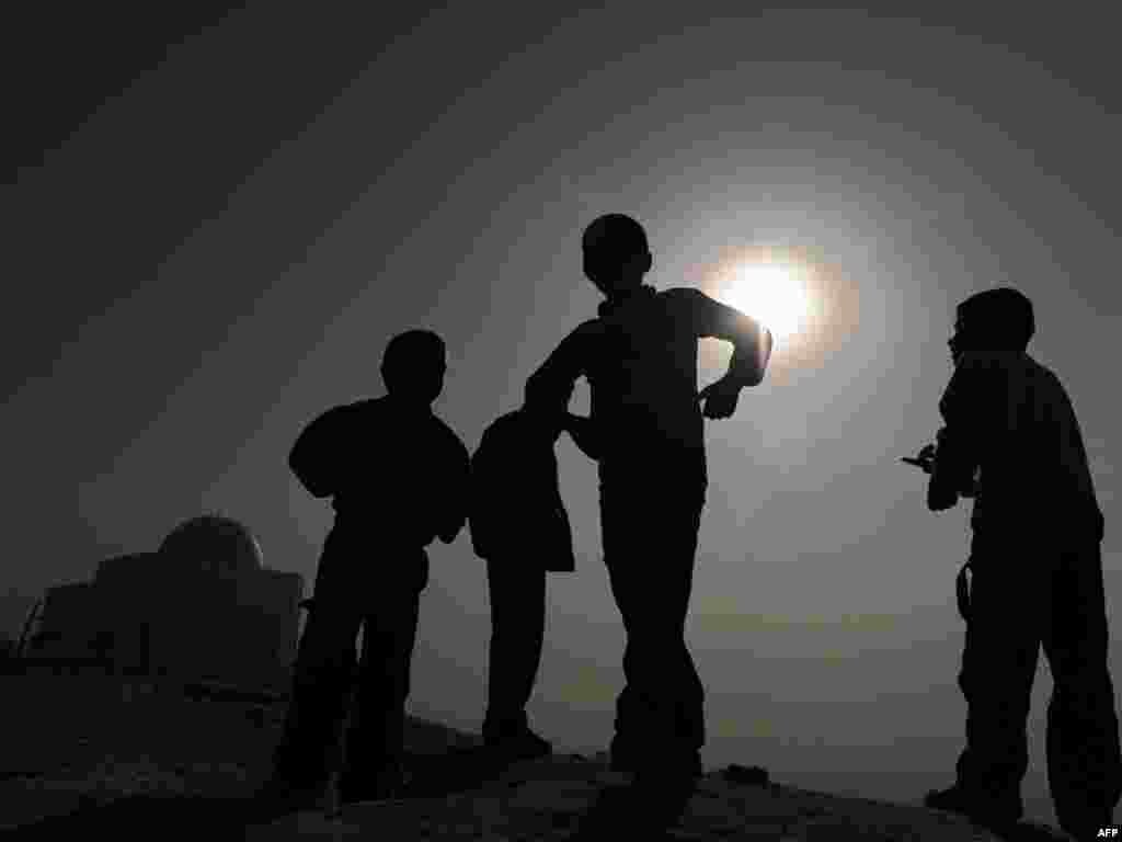 Afghan kids play at Nader Khan Hill overlooking Kabul on November 22. Children may be safer in the Afghan capital than in London or New York despite a deadly nine-year Taliban insurgency, NATO's top civilian representative in the country has said. Photo by Marai Shah for AFP