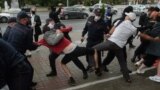 BELARUS -- Belarusian police and OMON officers detain students who march with the opposition flags to show their solidarity with political prisoners in Minsk, September 1, 2020