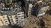 The aftermath of overnight Iranian missile strikes in Arad, southern Israel, on March 22.