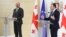 European Council President Charles Michel (left) last week called on Prime Minister Irakli Gharibashvili (right) and the country's political parties to engage in dialogue to defuse the "worsening crisis."