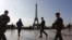 French soldiers patrol in front of the Eiffel Tower in Paris during the first round of the country's presidential election on April 23. 