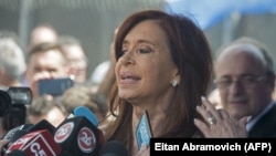 Former Argentinian President Cristina Fernandez de Kirchner speaks to reporters in Buenos Aires in October.