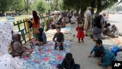 Afghan refugees seek to receive asylum from the United Nations High Commissioner for Refugees in Islamabad on May 9.