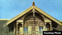 Window surrounds and carved balcony on a timber house from the exhibit "Carved And Colored Village Art From Tsarist Lands"