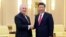 Chinese President Xi Jinping (right) shakes hands with U.S. Secretary of State Rex Tillerson in Beijing on March 19.