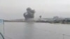 In a screen grab taken from a social media video released on July 15, smoke rises from southeastern port city of Chabahar amid US strikes on Iran. 